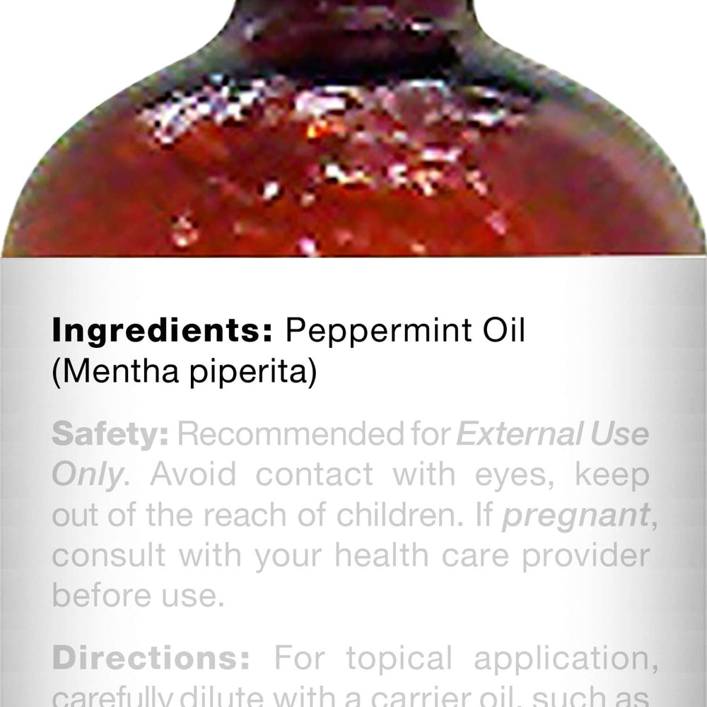 Majestic Pure dropper dispensing precise peppermint oil dose for controlled use