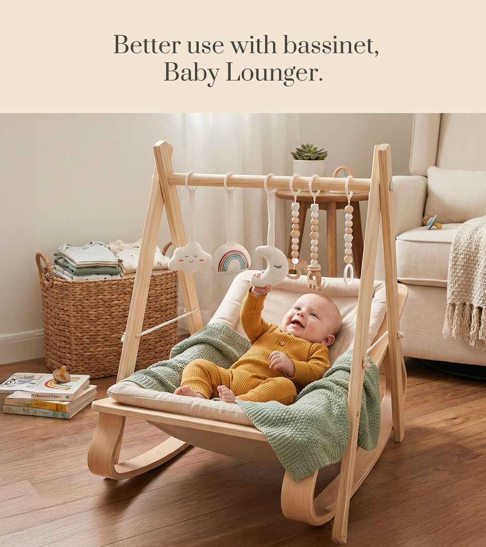 Mallify in-use tummy time setting with baby reaching for toys benefit: boosts motor skills