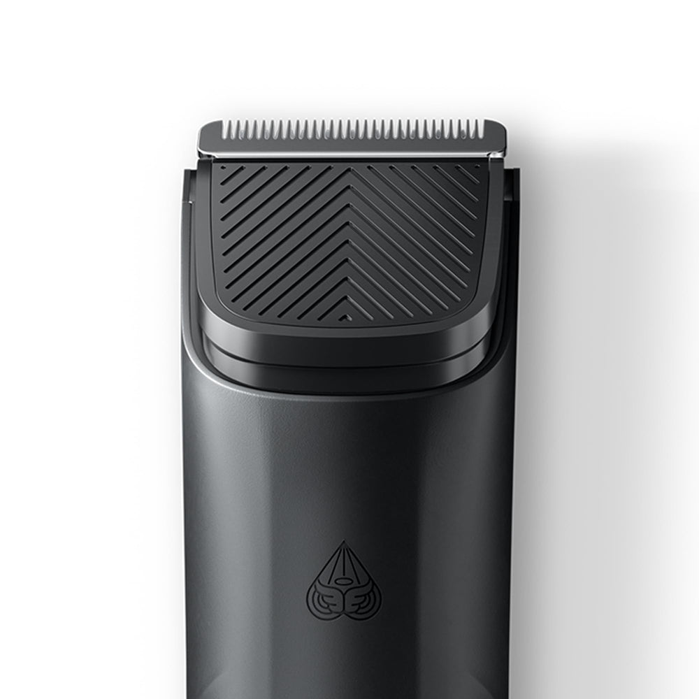 MANSCAPED blade next to hand for scale demonstrating compact convenience