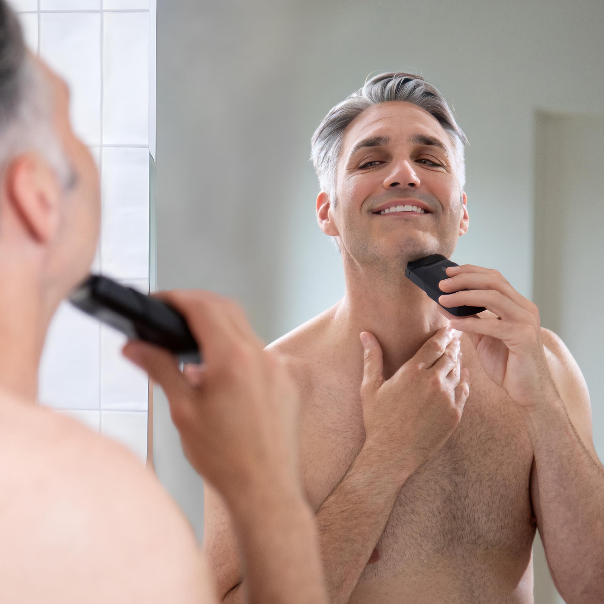 MANSCAPED used in front of mirror showing fast touch-up and neat grooming benefit