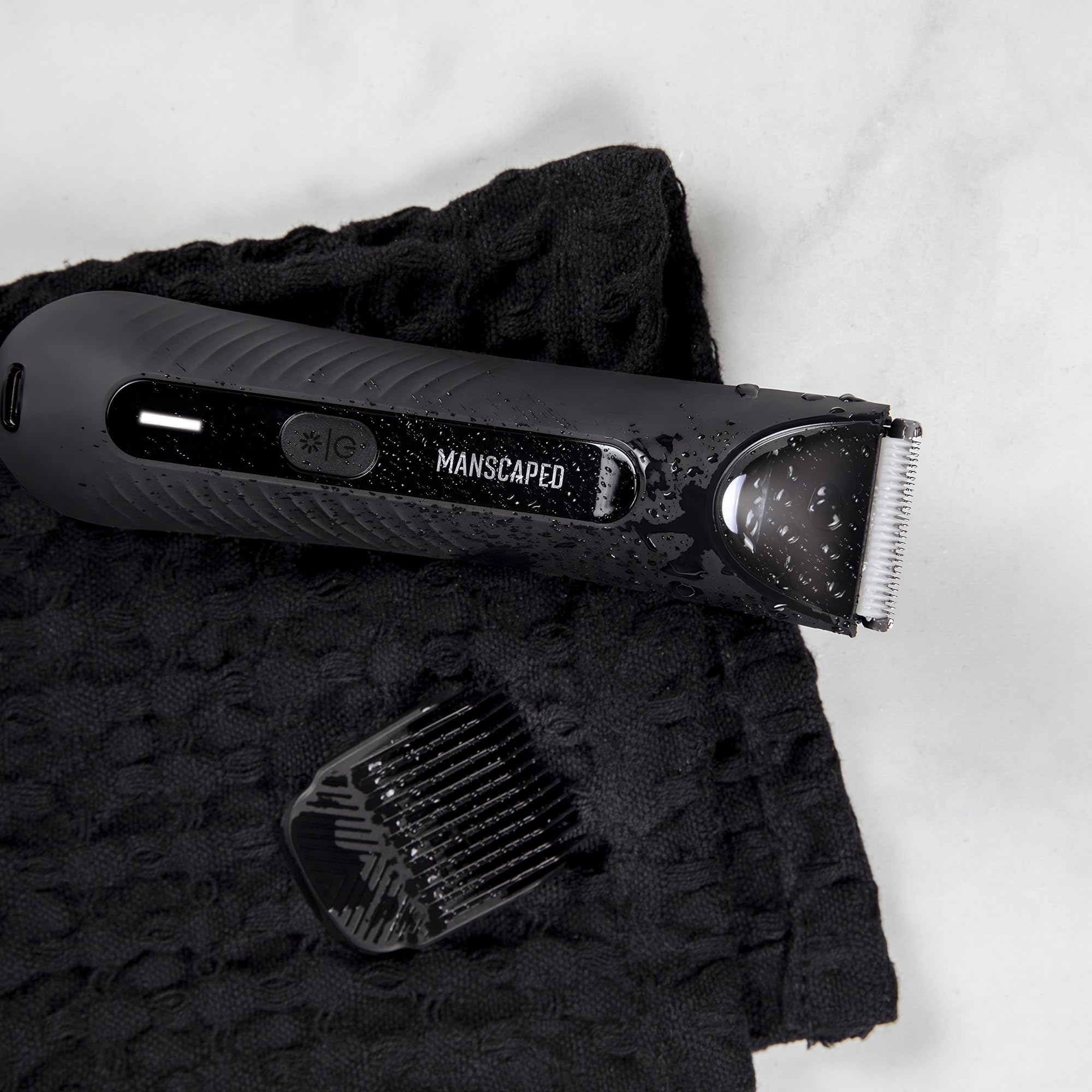MANSCAPED handheld size comparison demonstrating portable grooming convenience