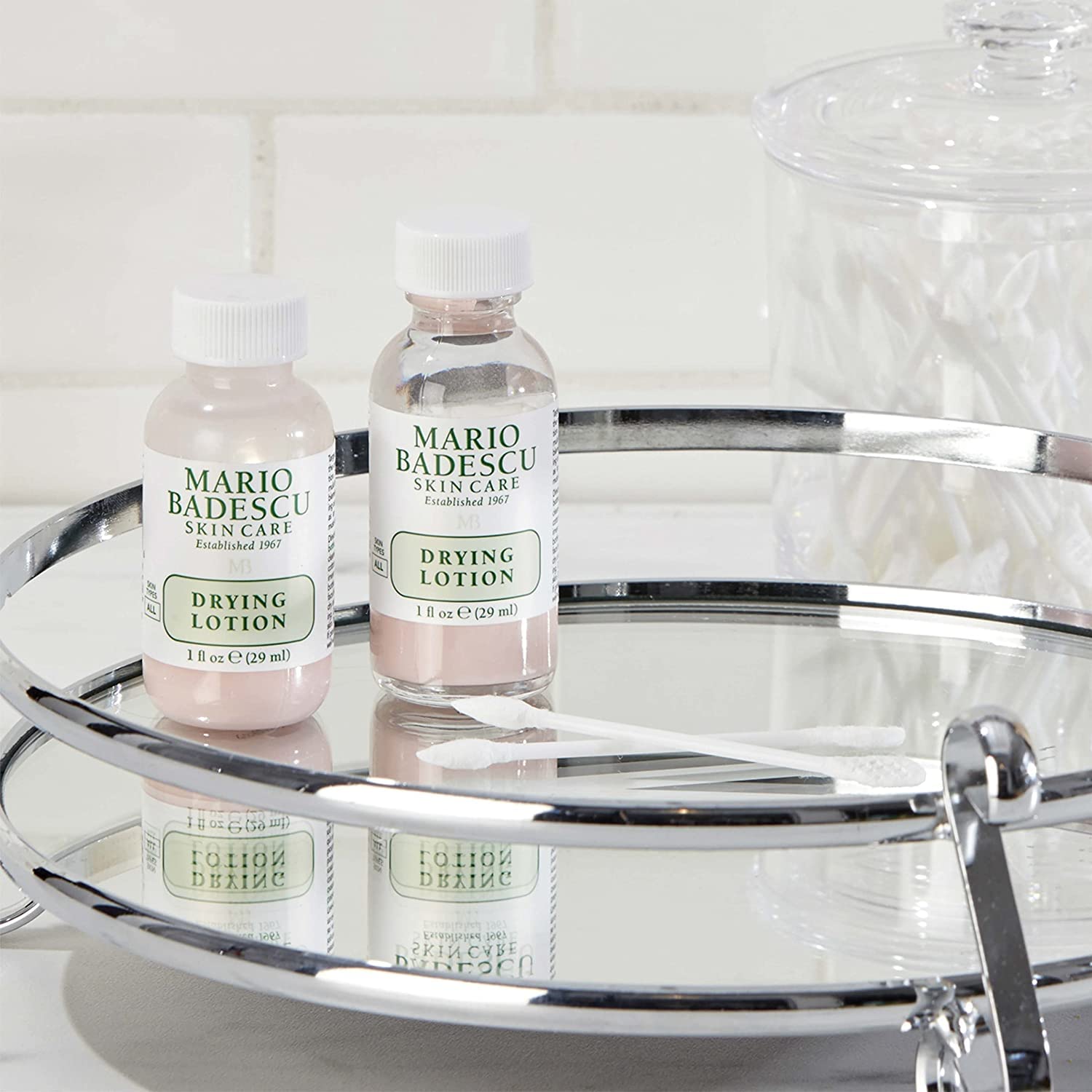 Mario Badescu kit next to coin for scale illustrating compact, travel-friendly size