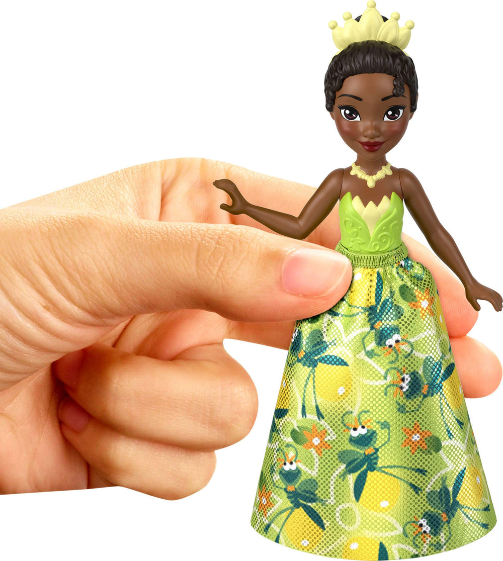 Mattel Disney Princess size comparison beside a hand to show portable scale