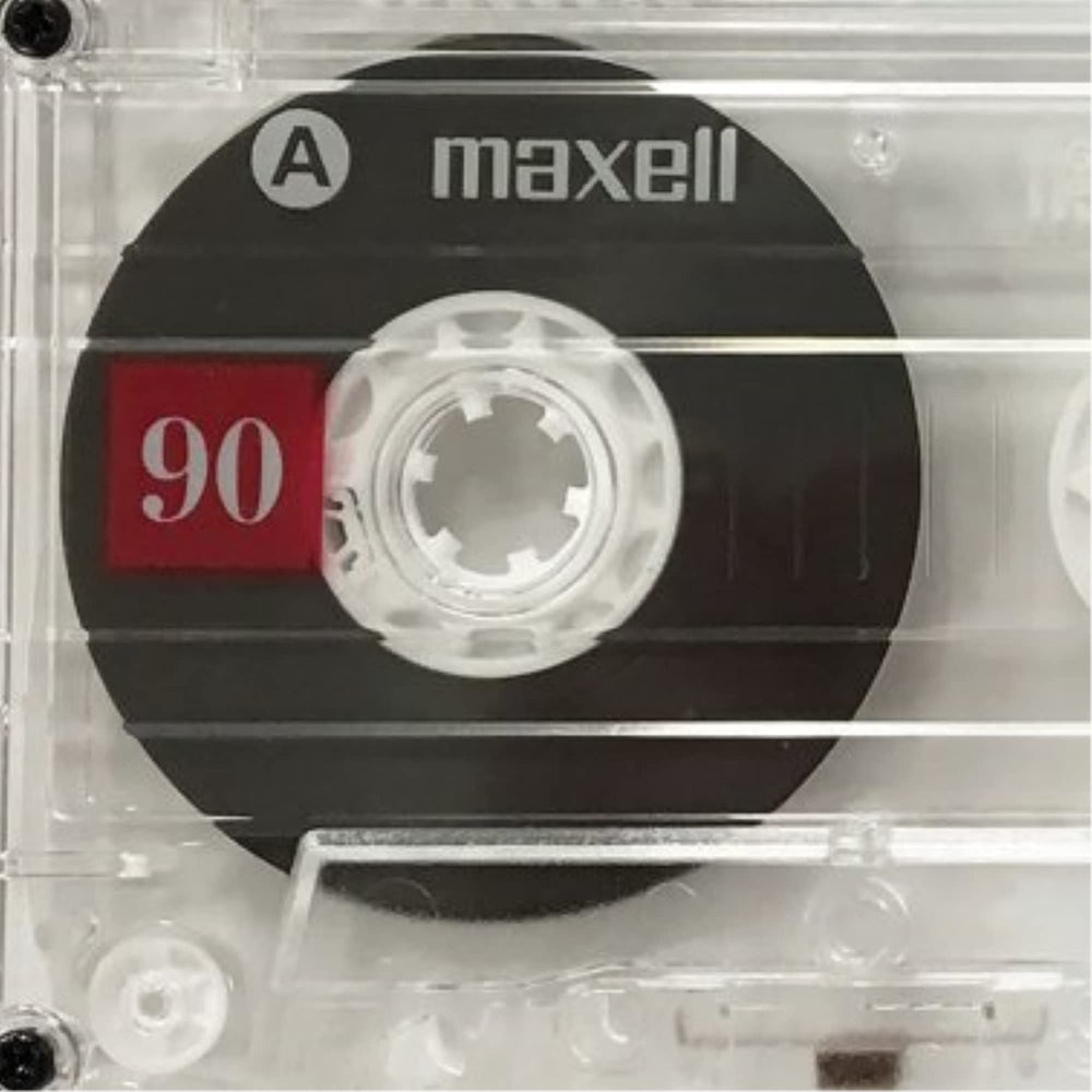 Maxell UR-90 close-up of cassette shell and tape reel highlighting durable casing and low-noise surface