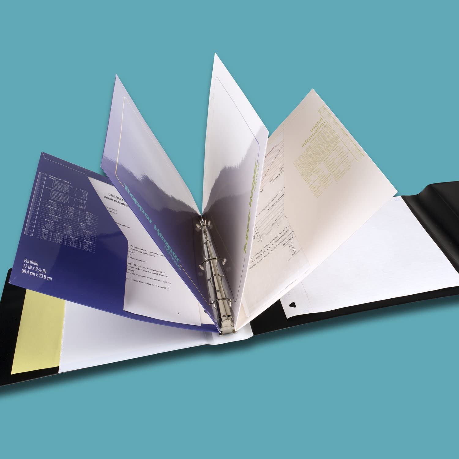 Mead Trapper Keeper open displaying folders and 1 inch metal rings for secure organization