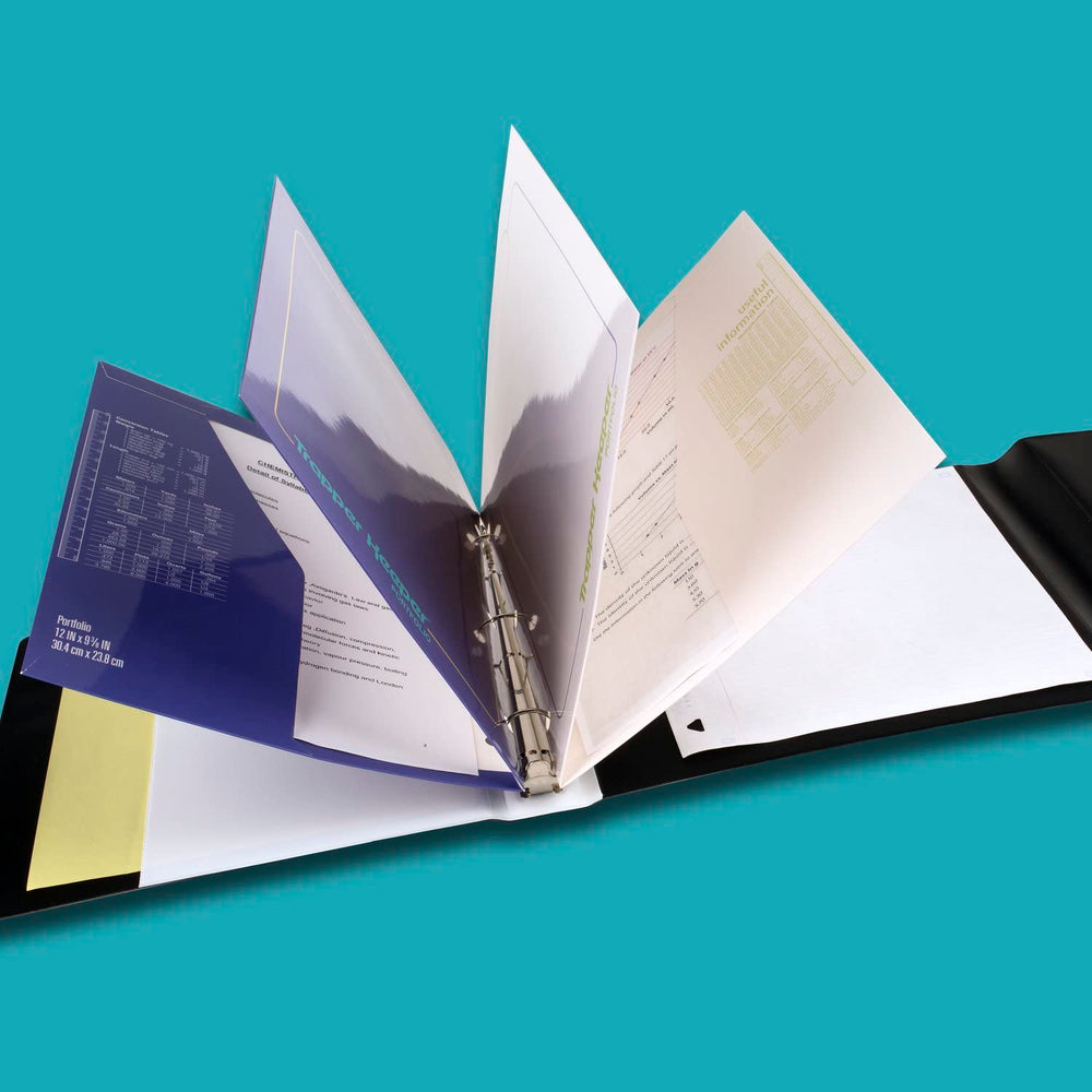 Mead Trapper Keeper open displaying folders and 1 inch metal rings for secure organization