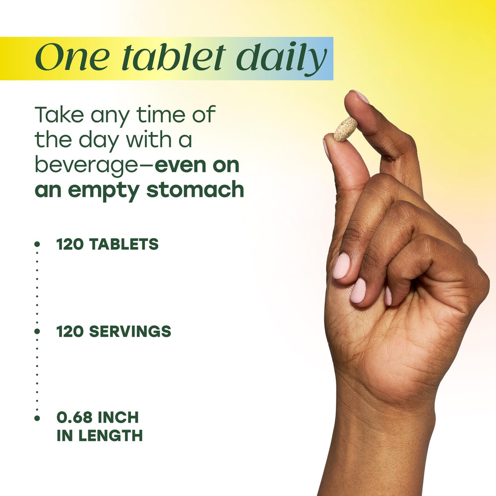 MegaFood tablets in hand displaying smooth finish and tablet size
