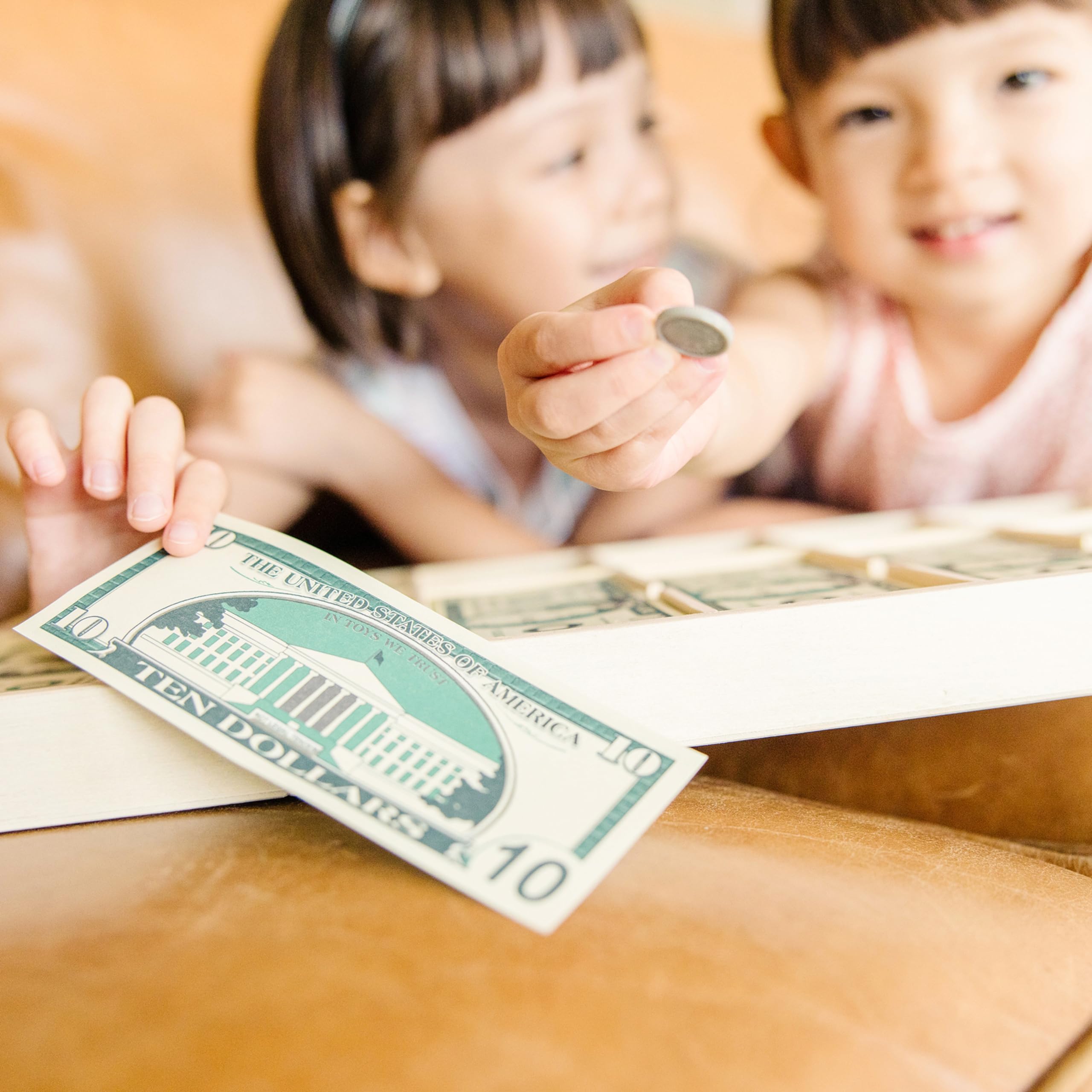 Melissa & Doug hands counting bills and coins for hands-on math practice