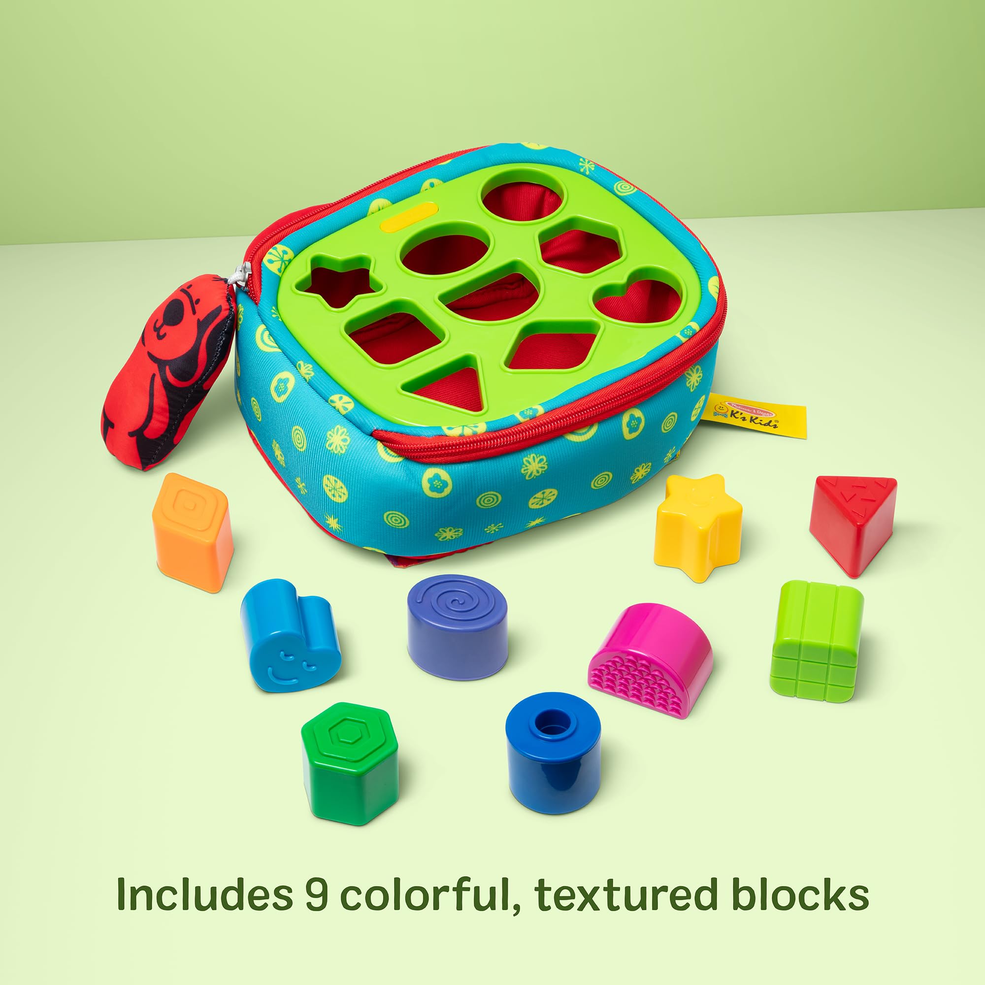 Melissa & Doug child inserting a textured block into a matching hole to practice fine motor skills