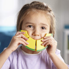 Melissa & Doug child playing with fruit set demonstrating fine motor development