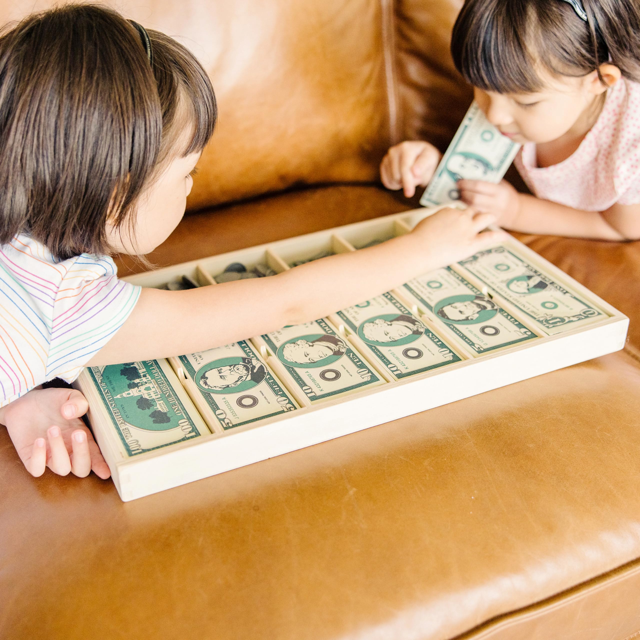 Melissa & Doug children role-playing a pretend store to practice counting