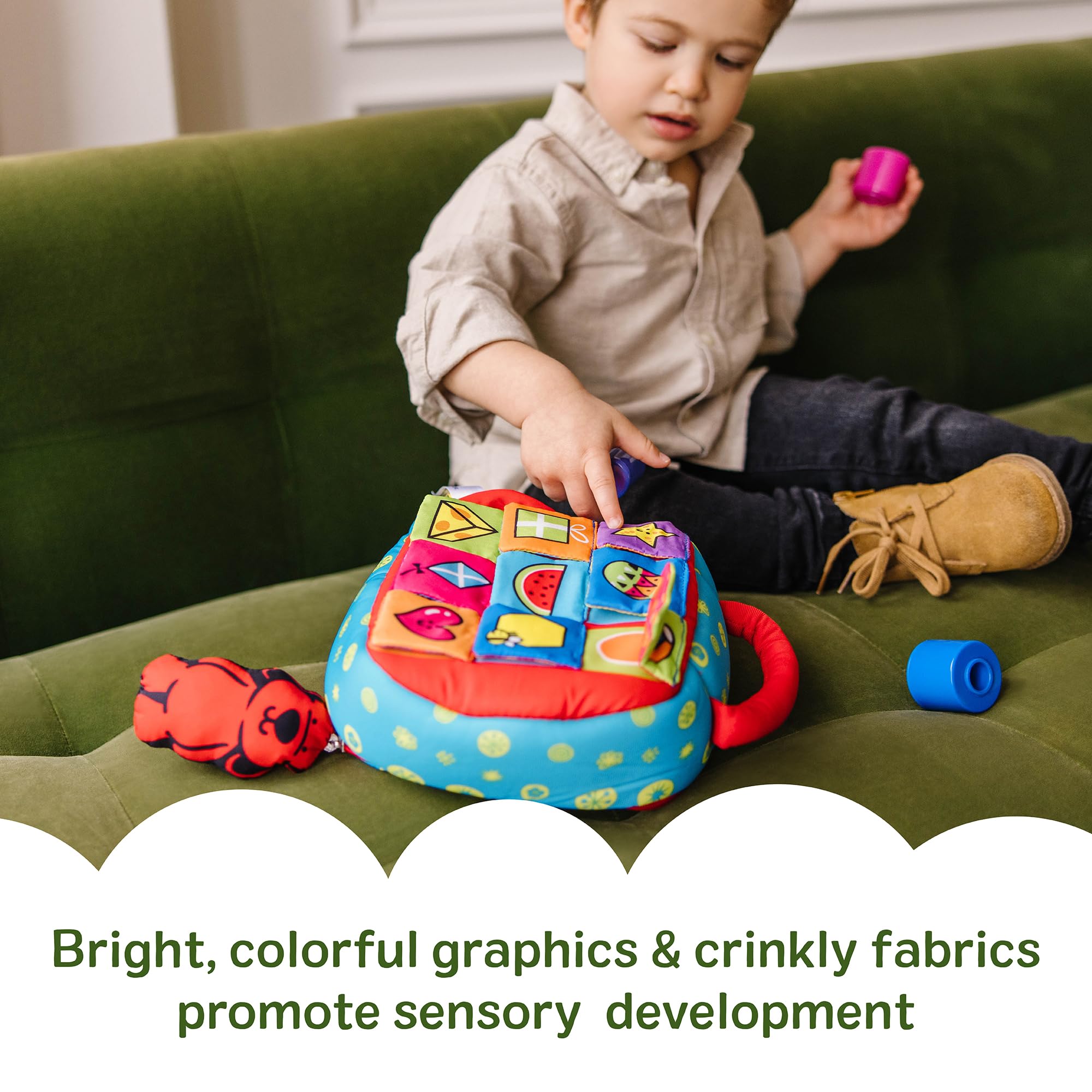 Melissa & Doug crinkly flap being lifted to reveal a picture, encouraging curiosity and vocabulary building