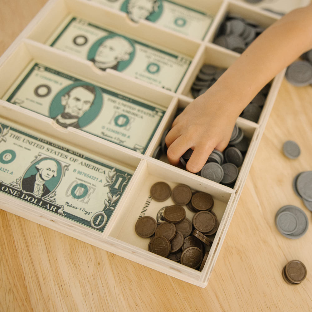 Melissa & Doug play money used at a kitchen lemonade stand for imaginative play
