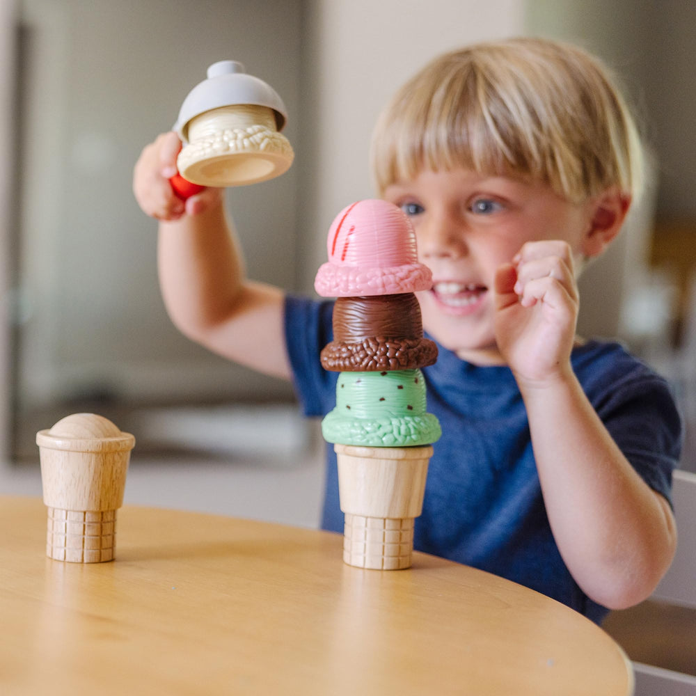 Melissa & Doug child using set to serve cones promoting social play