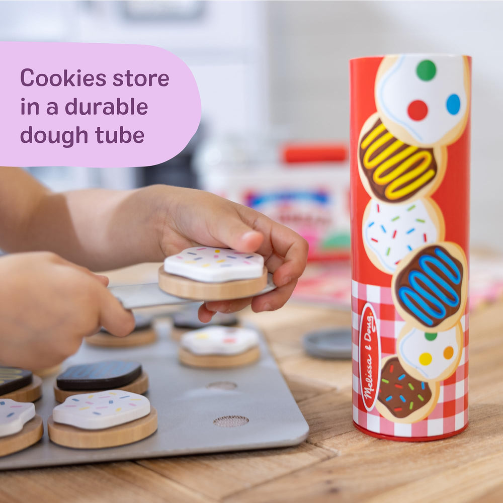 Melissa & Doug hand beside cookies for size comparison and scale reference