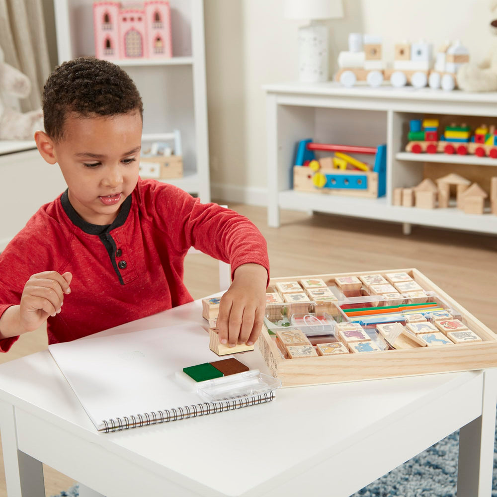 Melissa & Doug hand holding stamp showing size and easy control