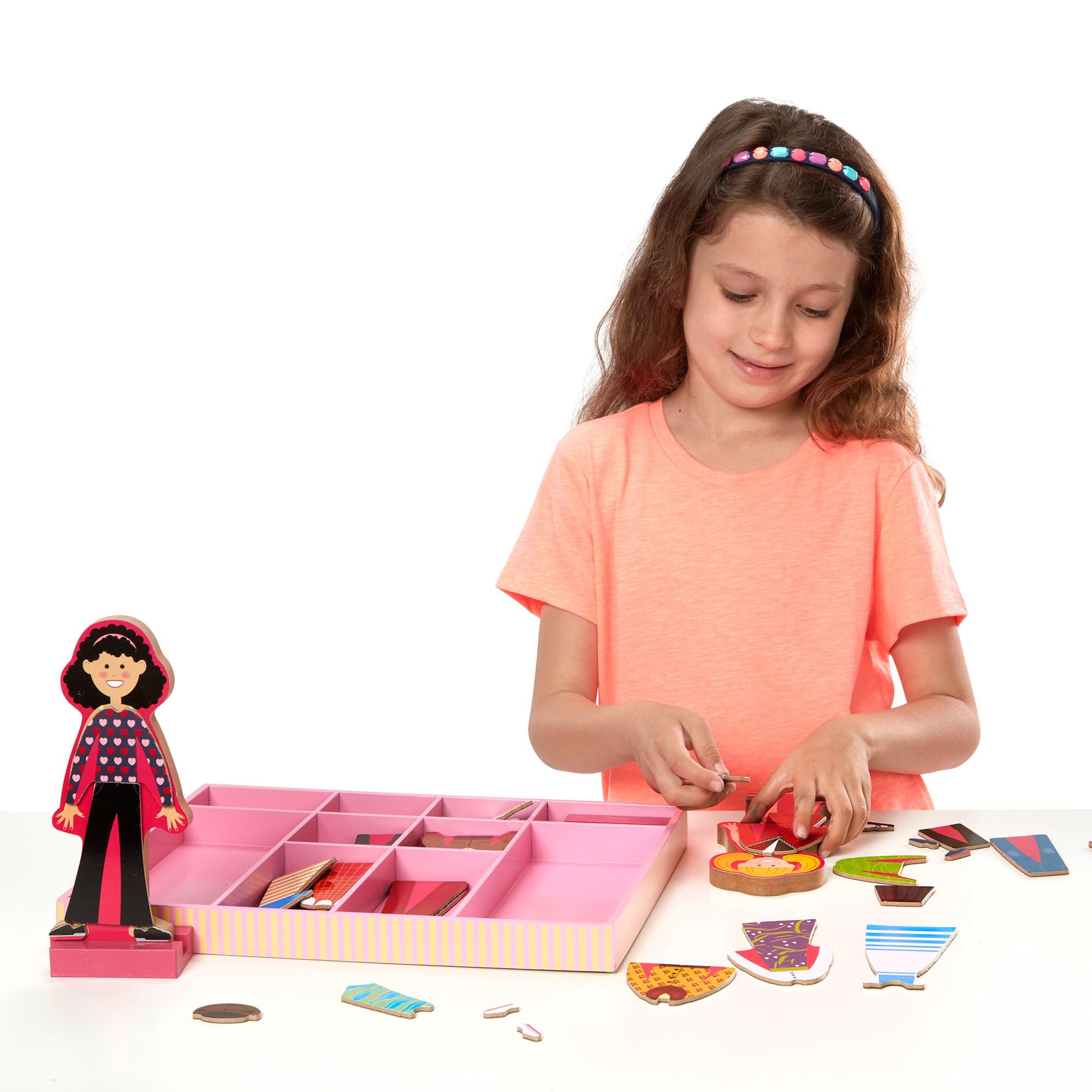 Melissa & Doug hand holding doll showing scale and child-friendly size