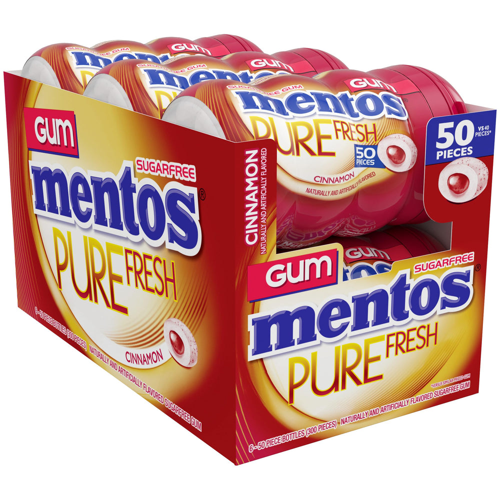 hand holding Mentos cinnamon bottle demonstrating portable bottle size and easy carry