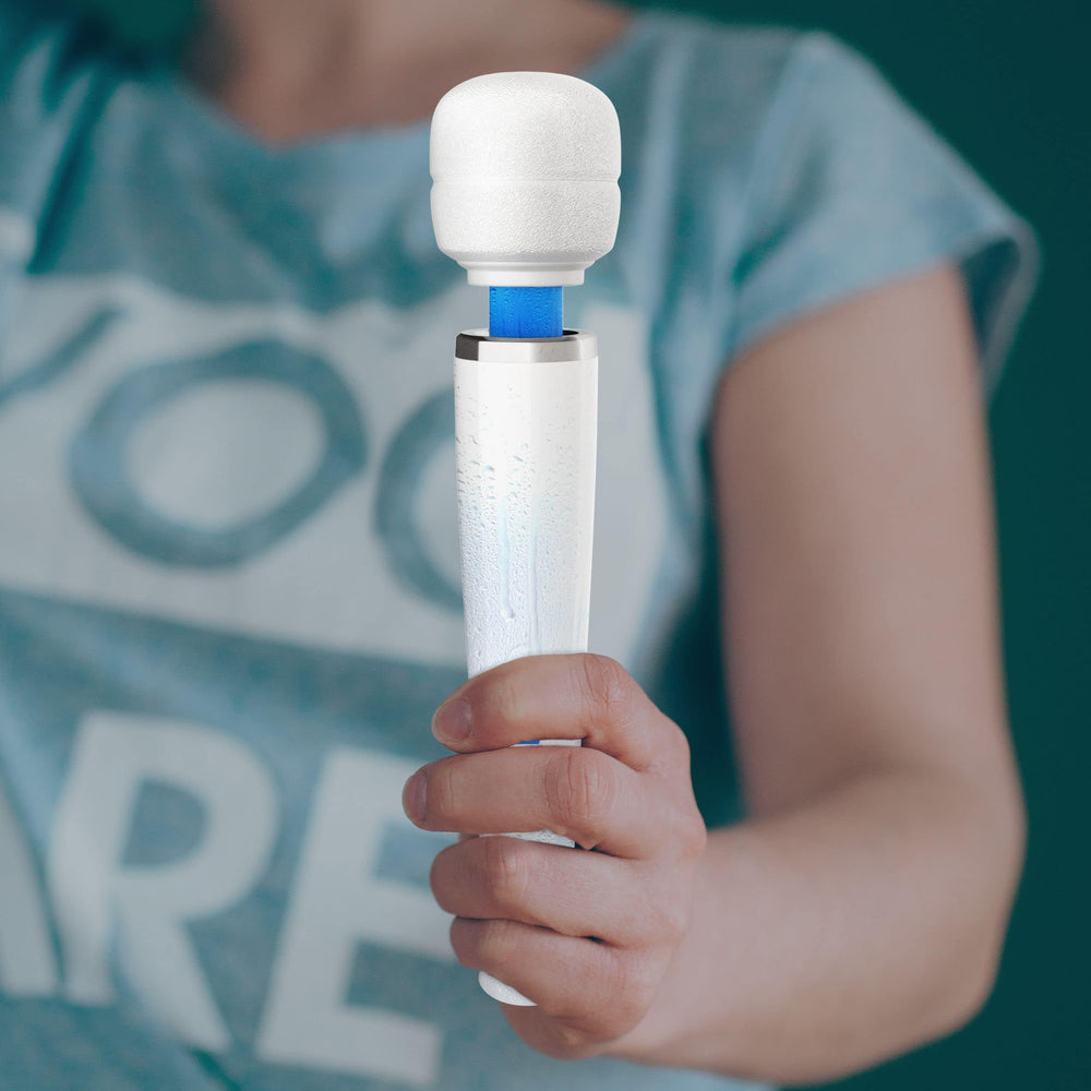 Metooka held next to a hand to show compact portable size