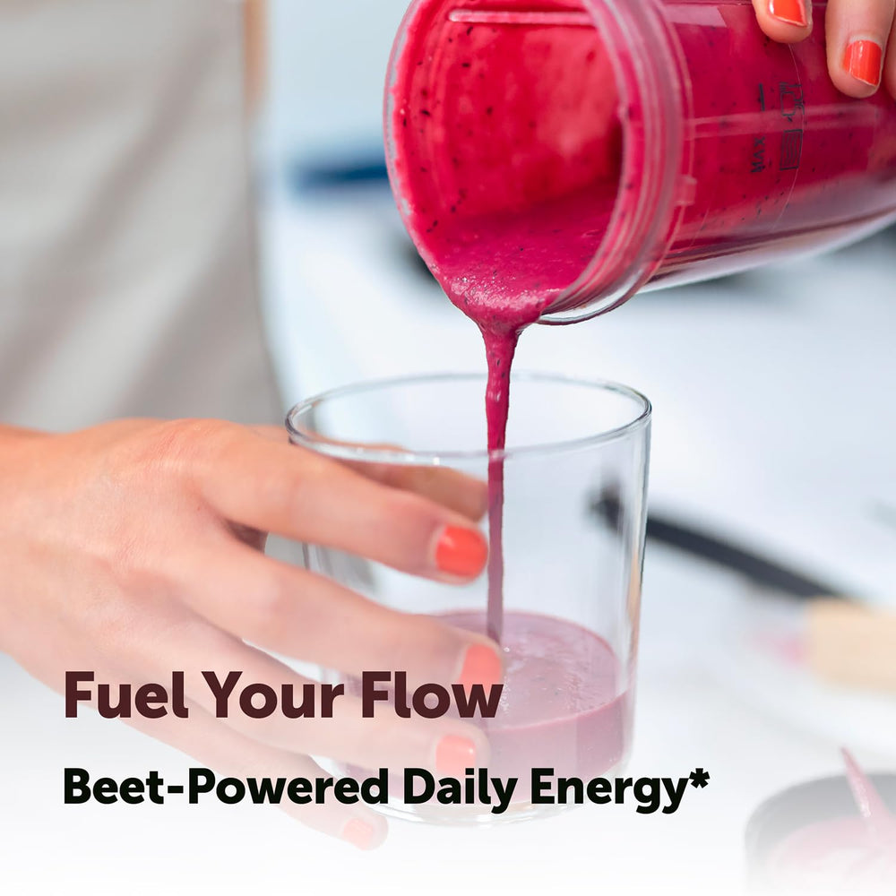 Glass bottle with Micro Ingredients beet smoothie, showing vibrant color and mixability
