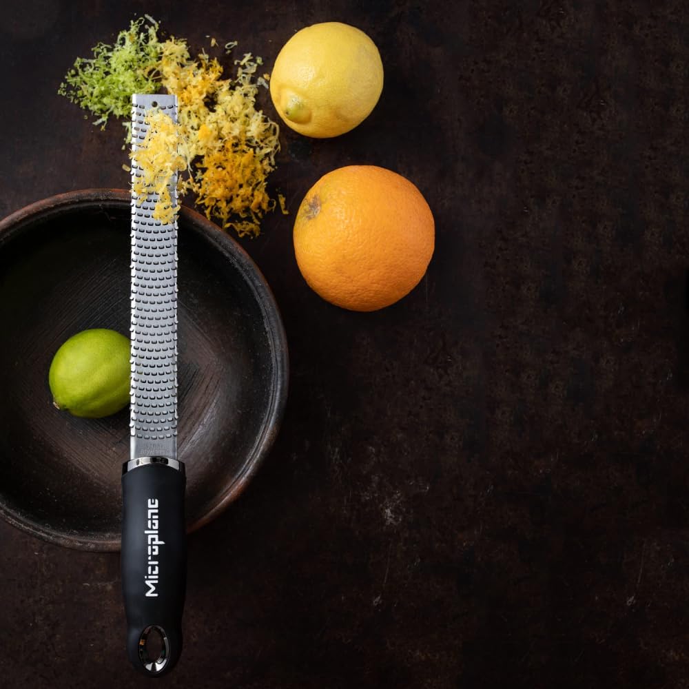 Microplane hanging on magnetic strip for convenient kitchen storage
