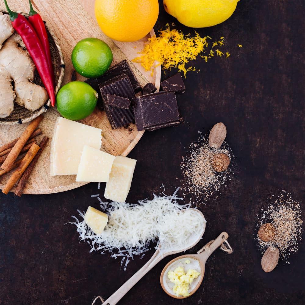Microplane zesting lemon over bowl showing bright citrus flavor capture