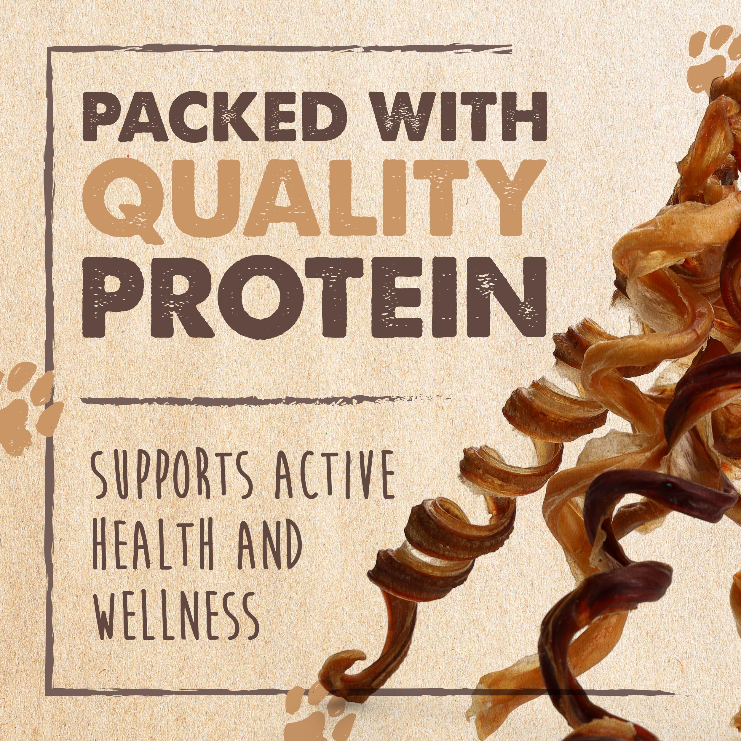 Worker hand-packing Mighty Paw bully sticks, highlights careful inspection and quality