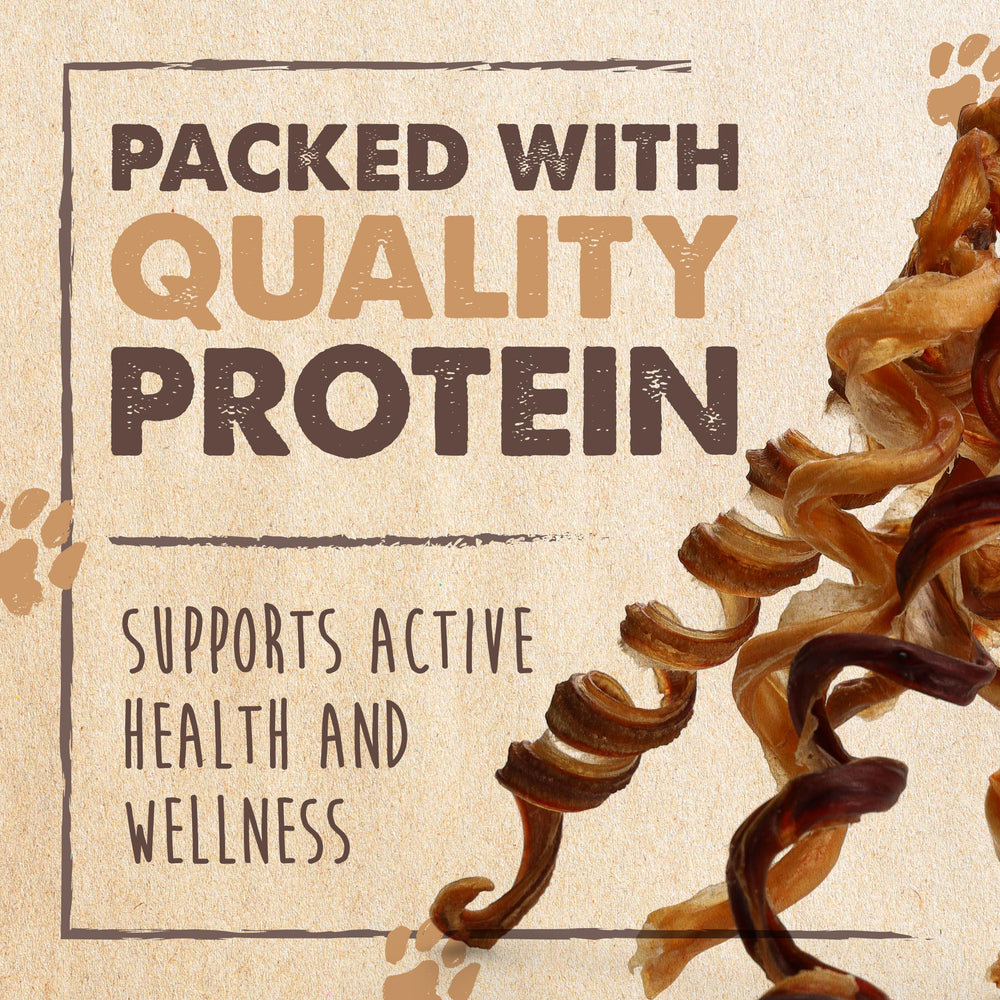 Worker hand-packing Mighty Paw bully sticks, highlights careful inspection and quality