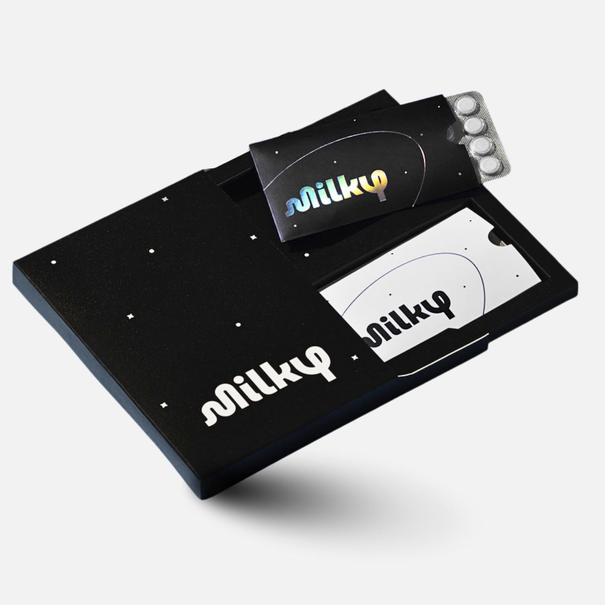 Milky front packaging Cosmic Black showing compact tablet pack and sleek design