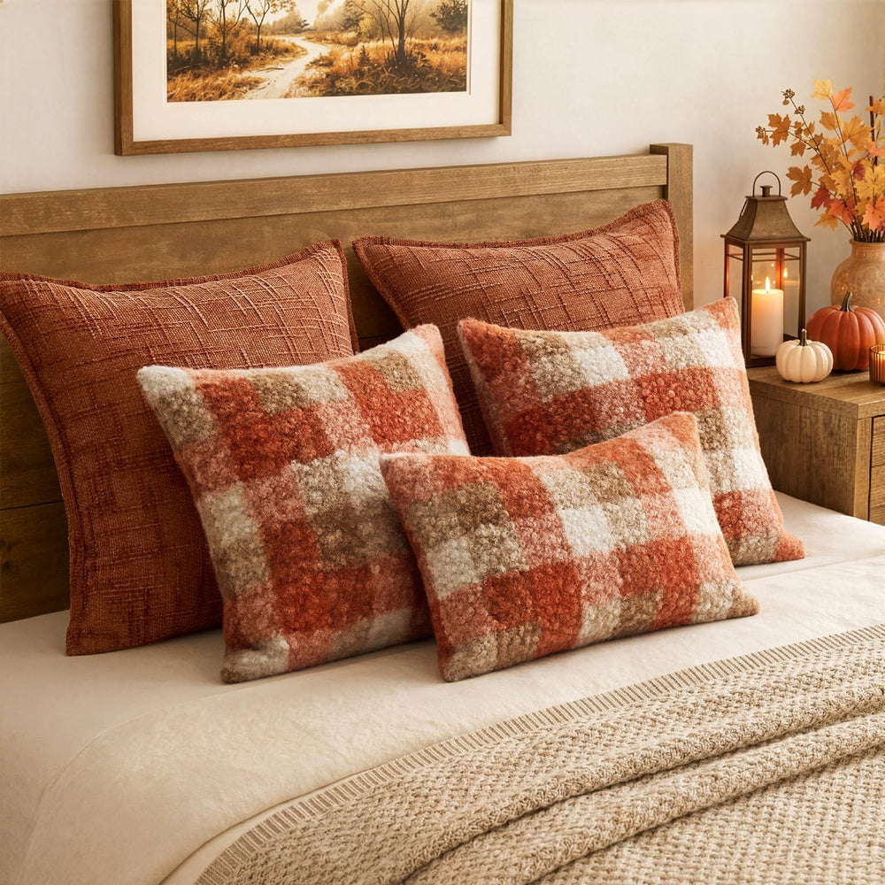 MIULEE on bed layered with throws for textured comfort