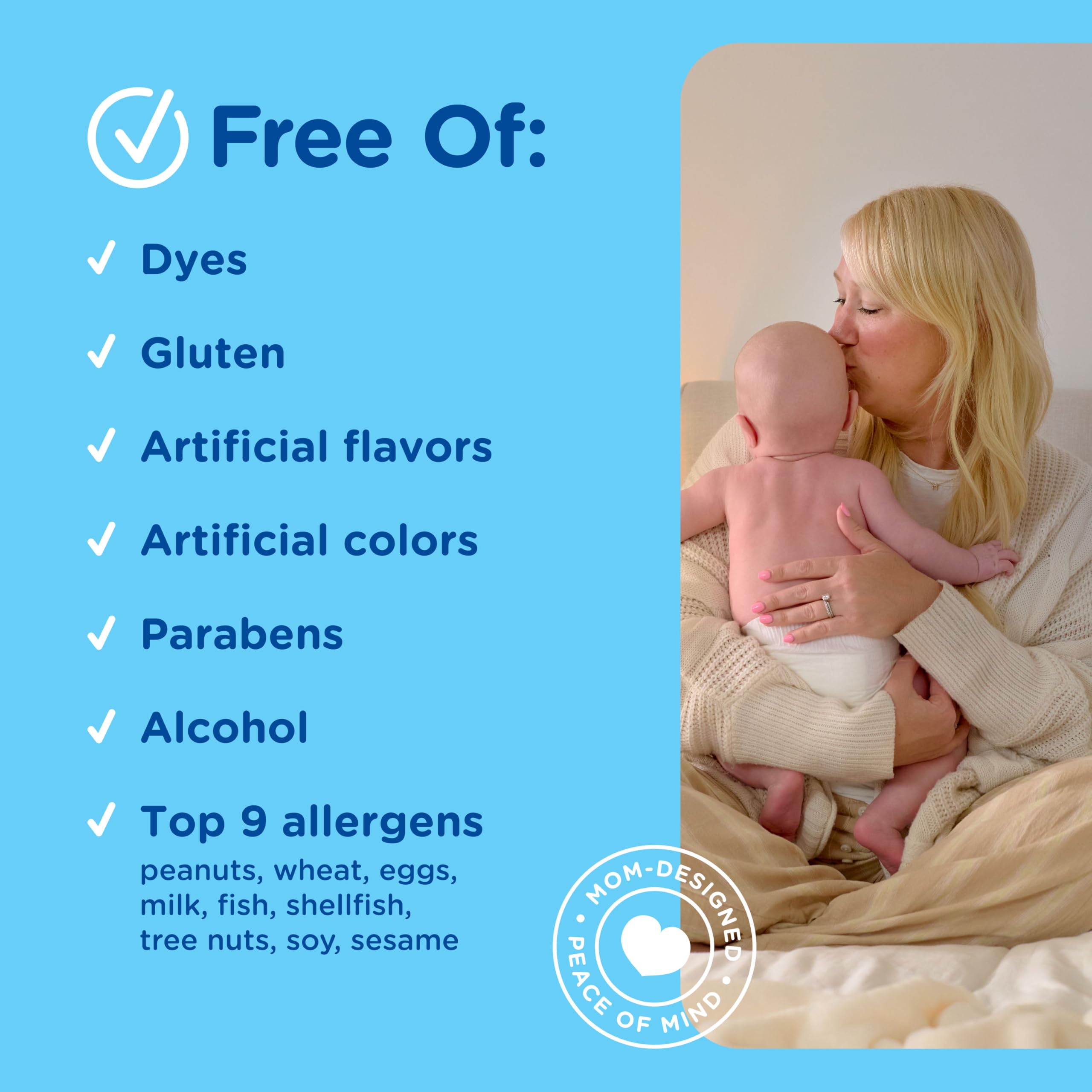 Mommy's Bliss bottle next to adult finger showing compact size and portability