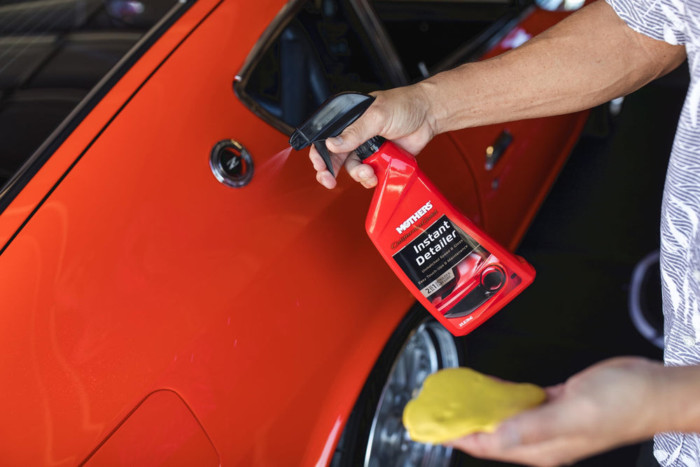 Applying Mothers clay bar to vehicle roof for smooth, contaminant-free finish