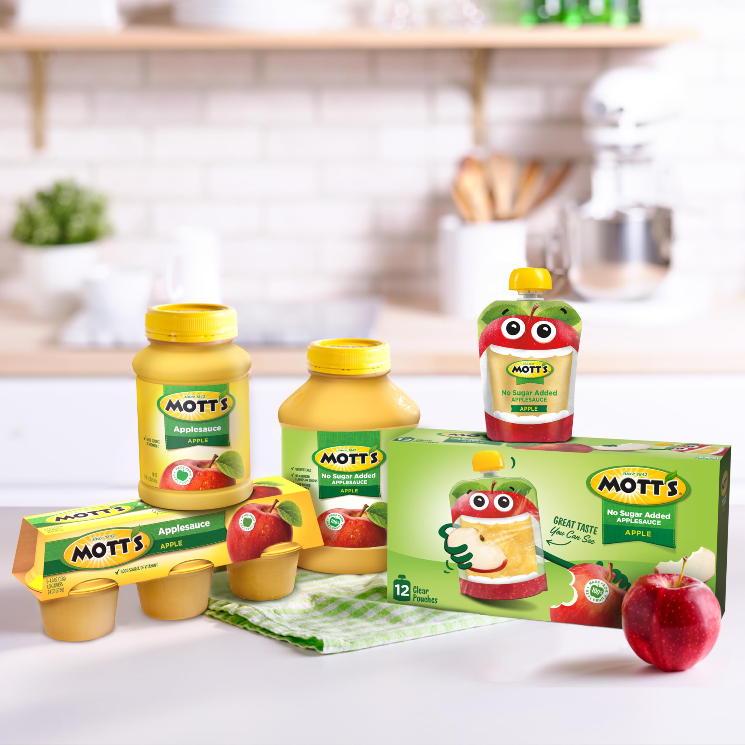 Mott's eight jars stacked in pantry for bulk storage convenience