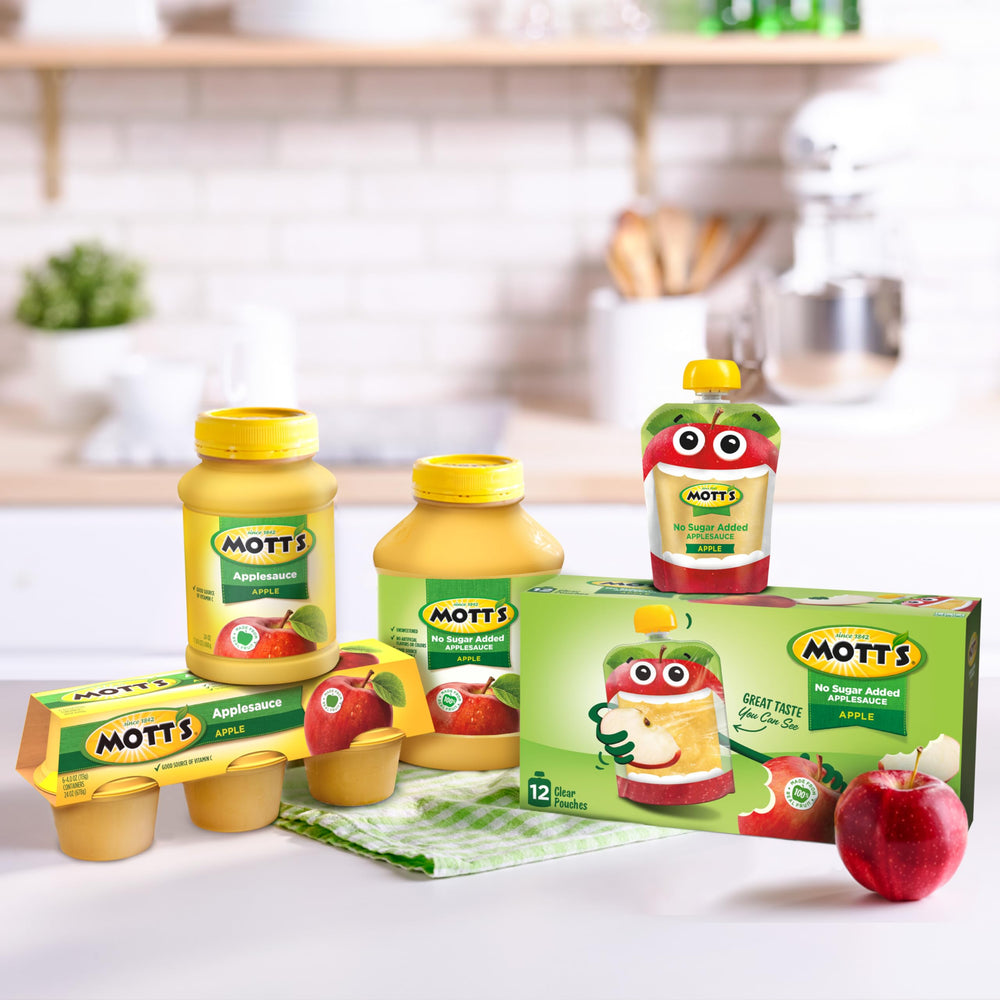Mott's eight jars stacked in pantry for bulk storage convenience