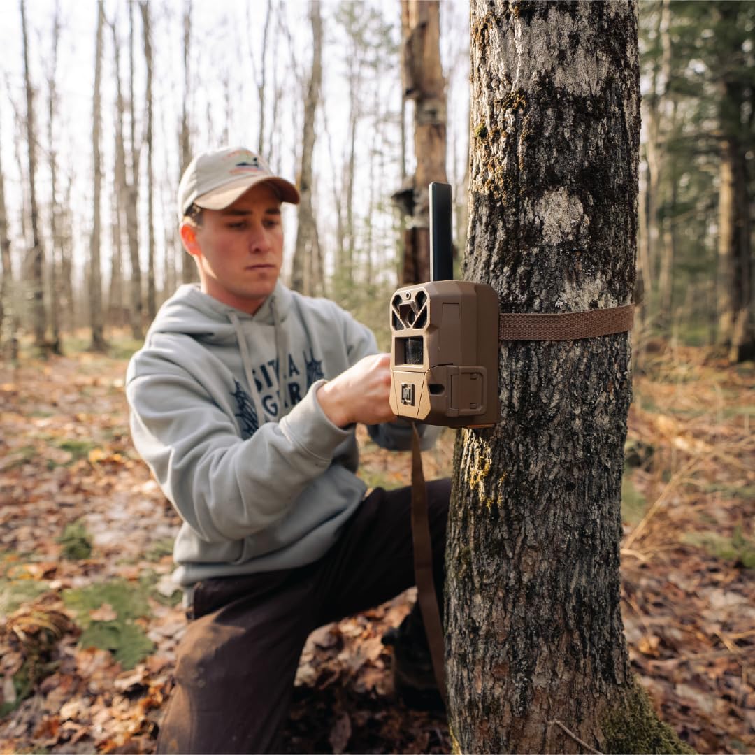 User holding Moultrie EDGE 3 using Live Aim to precisely position camera for accurate coverage
