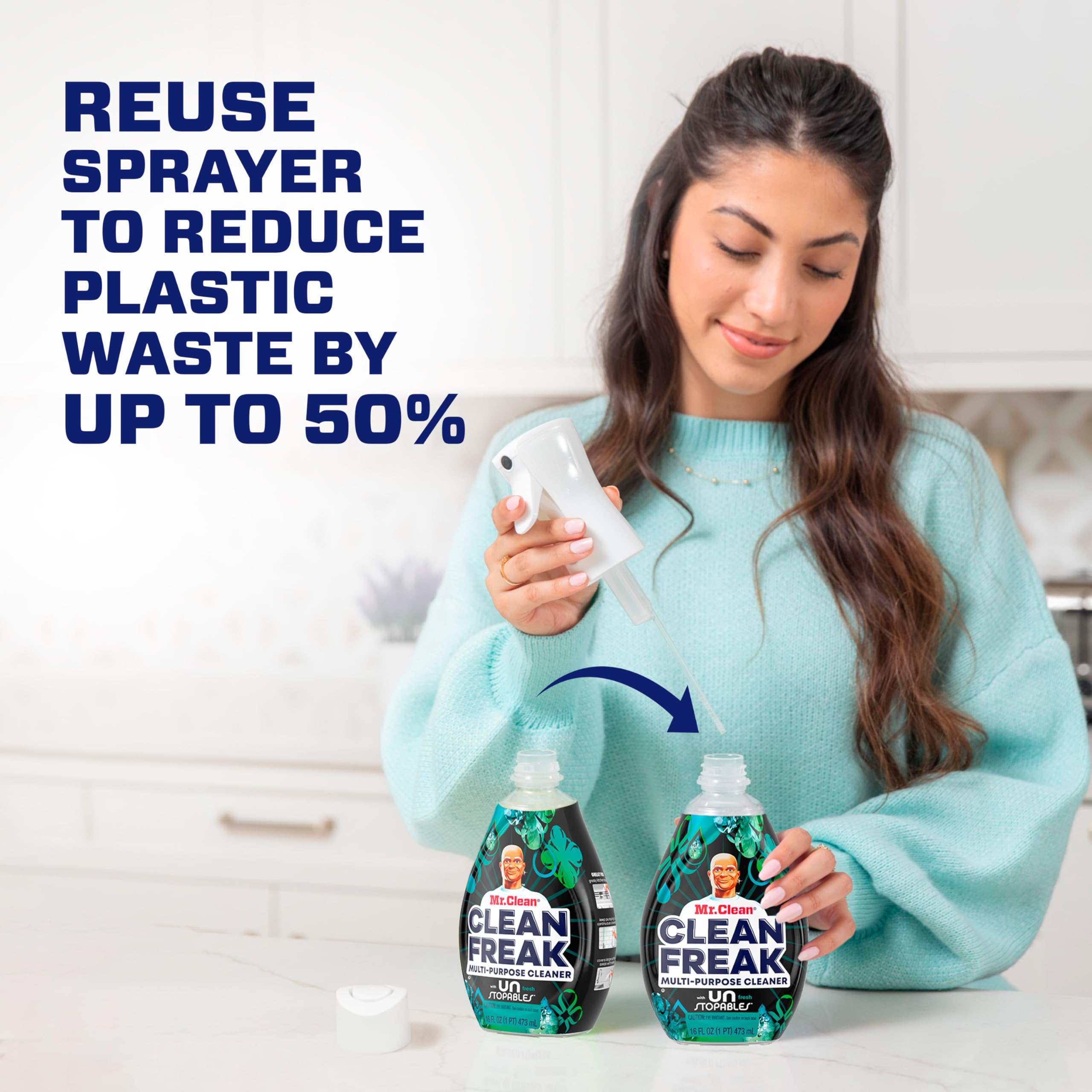 Mr. Clean spray mist activating on countertop for faster grease removal benefit