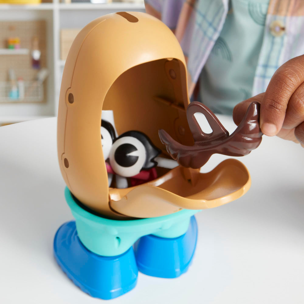 Child playing with Mr. Potato Head set encouraging creativity and fine motor skills