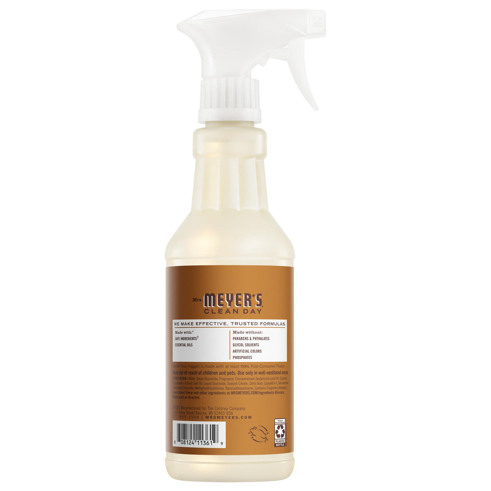 Mrs. MEYER'S bottle spraying cleaner onto countertop demonstrating quick cleanup benefit