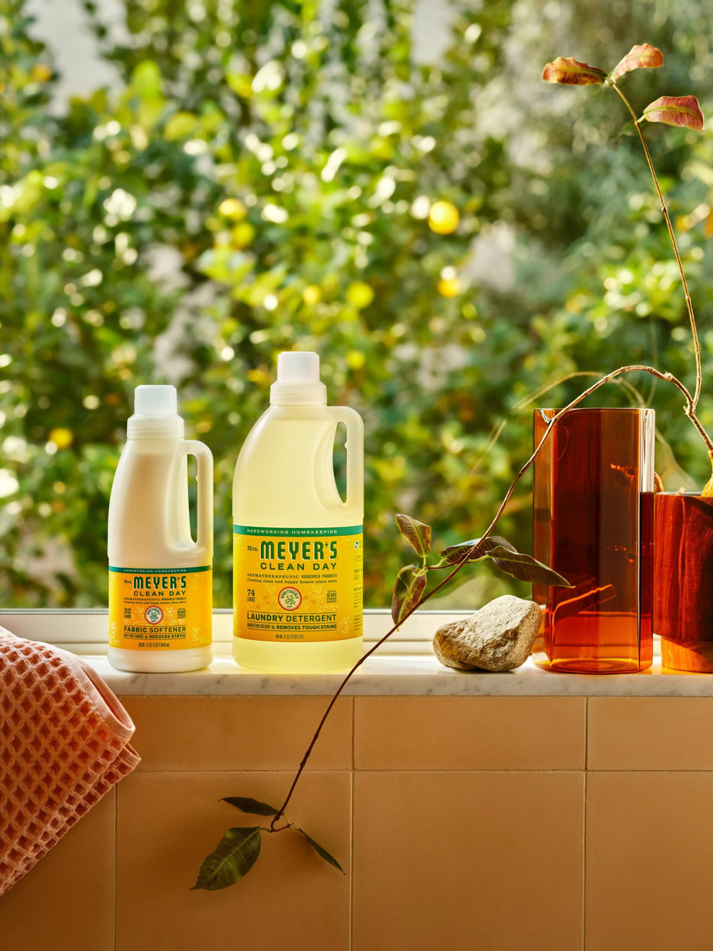 Mrs. MEYER'S laundry basket with fresh linens conveying honeysuckle scent freshness