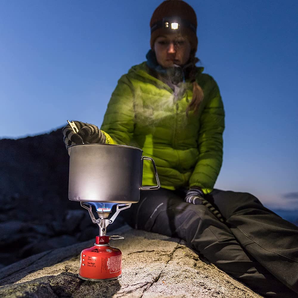MSR PocketRocket collapsed in hand showing ultralight compact packing