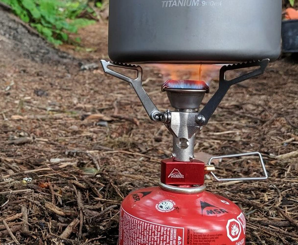 MSR PocketRocket beside a water bottle showing size and weight scale