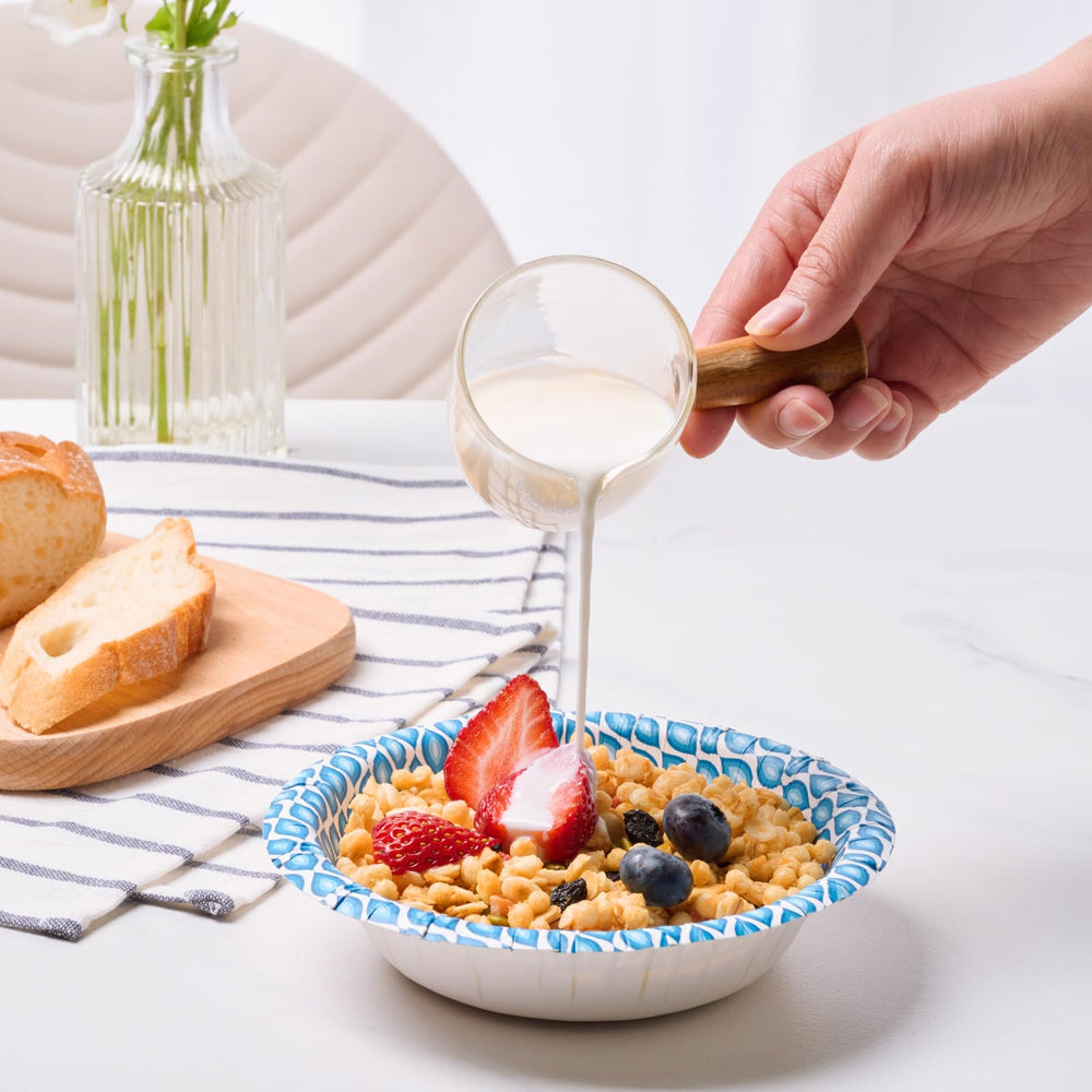 MUCHII bowl held in hand showing 12 oz scale for portion control