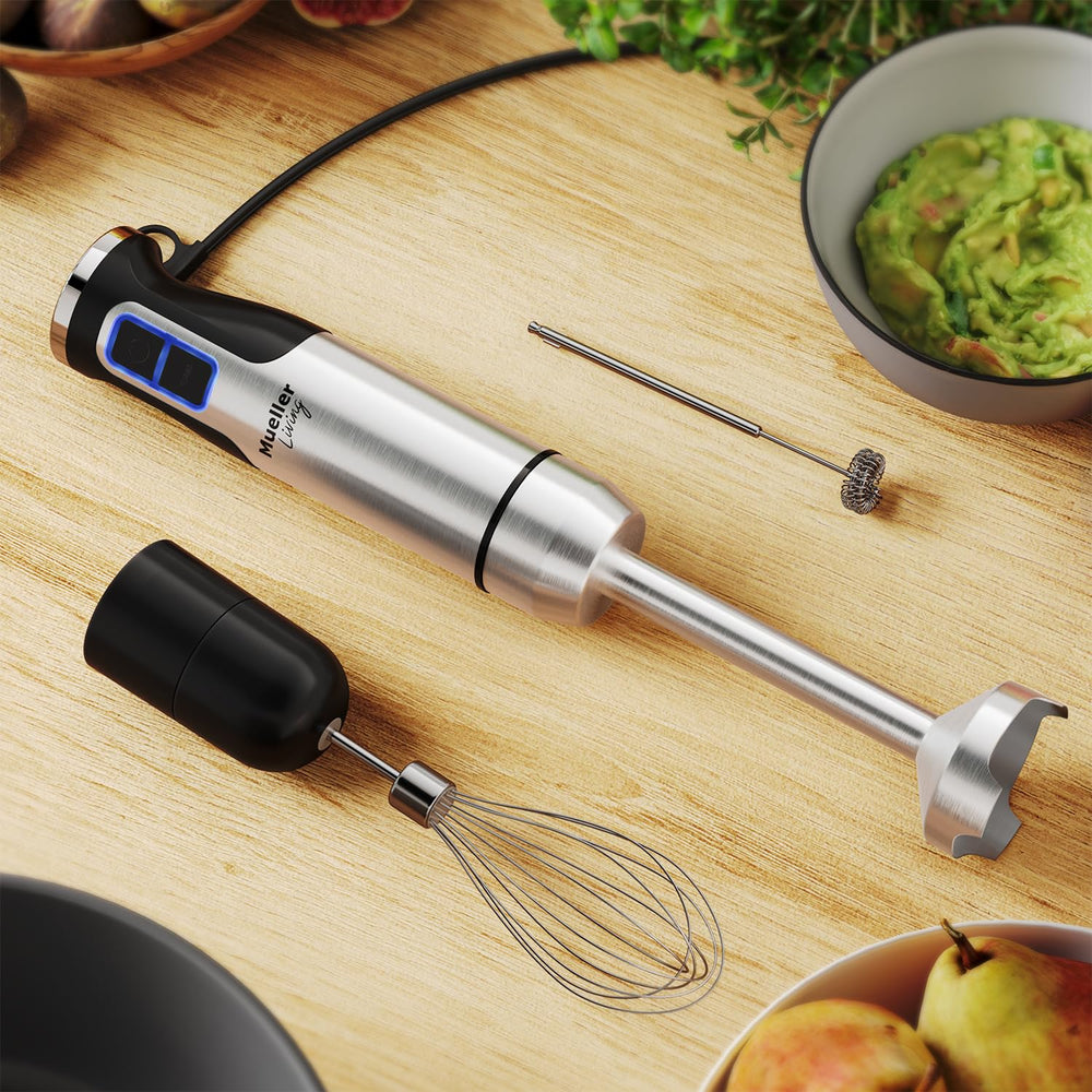 Mueller accessories laid out showing shaft, whisk, frother, and beaker