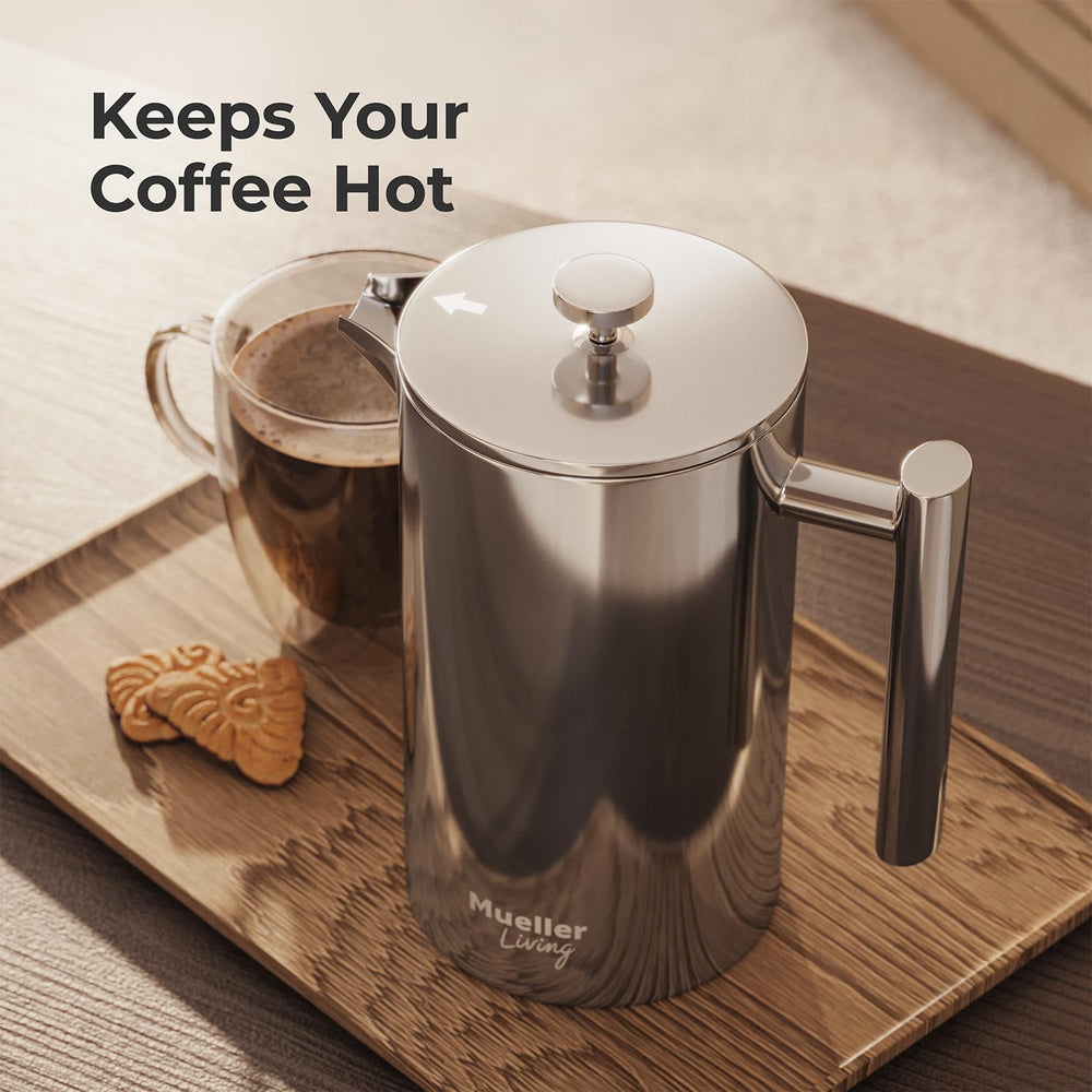 Mueller press on a campsite table with mug showing rugged rust‑free stainless steel for travel durability