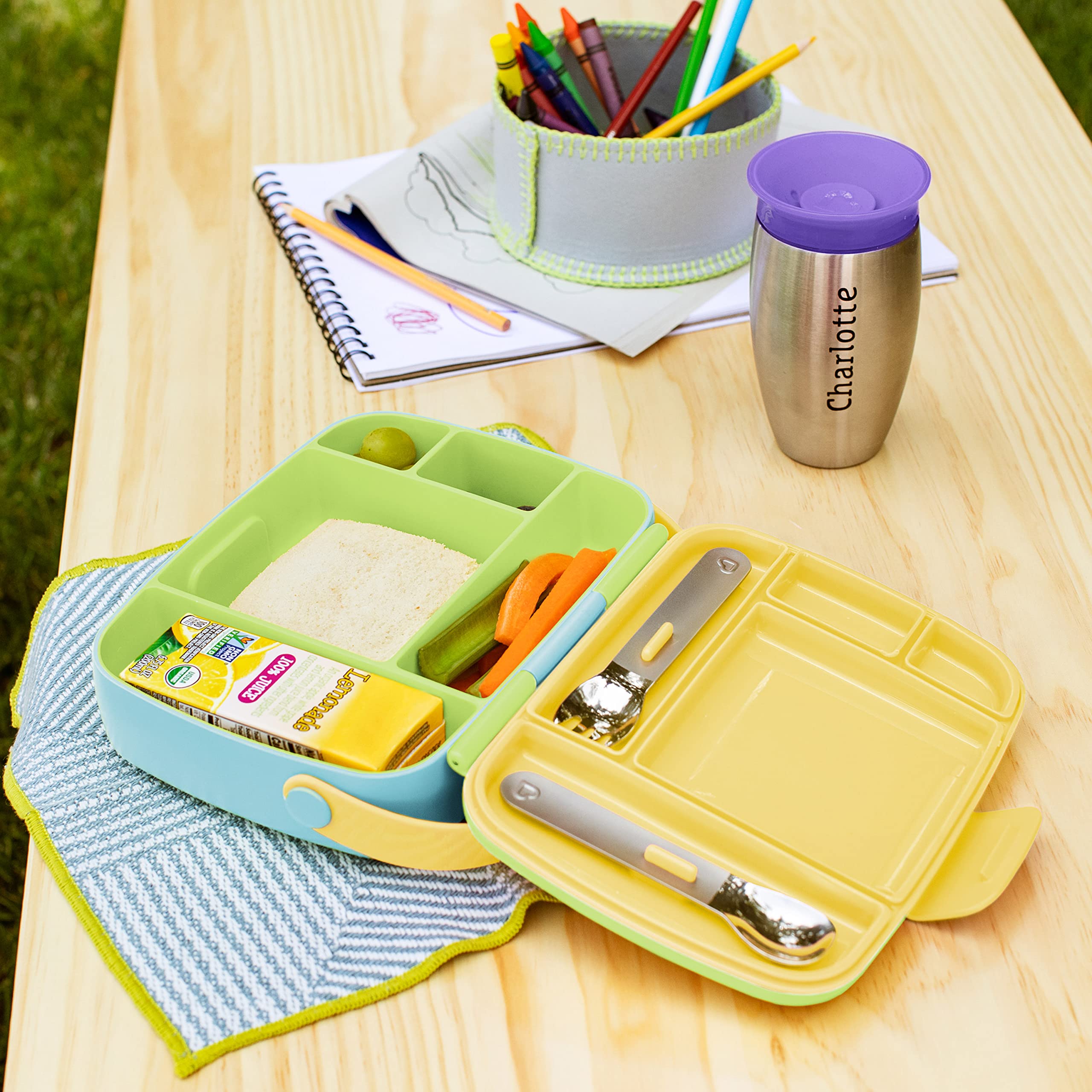Munchkin packed bento with sandwich, fruit, veggies demonstrating meal setup