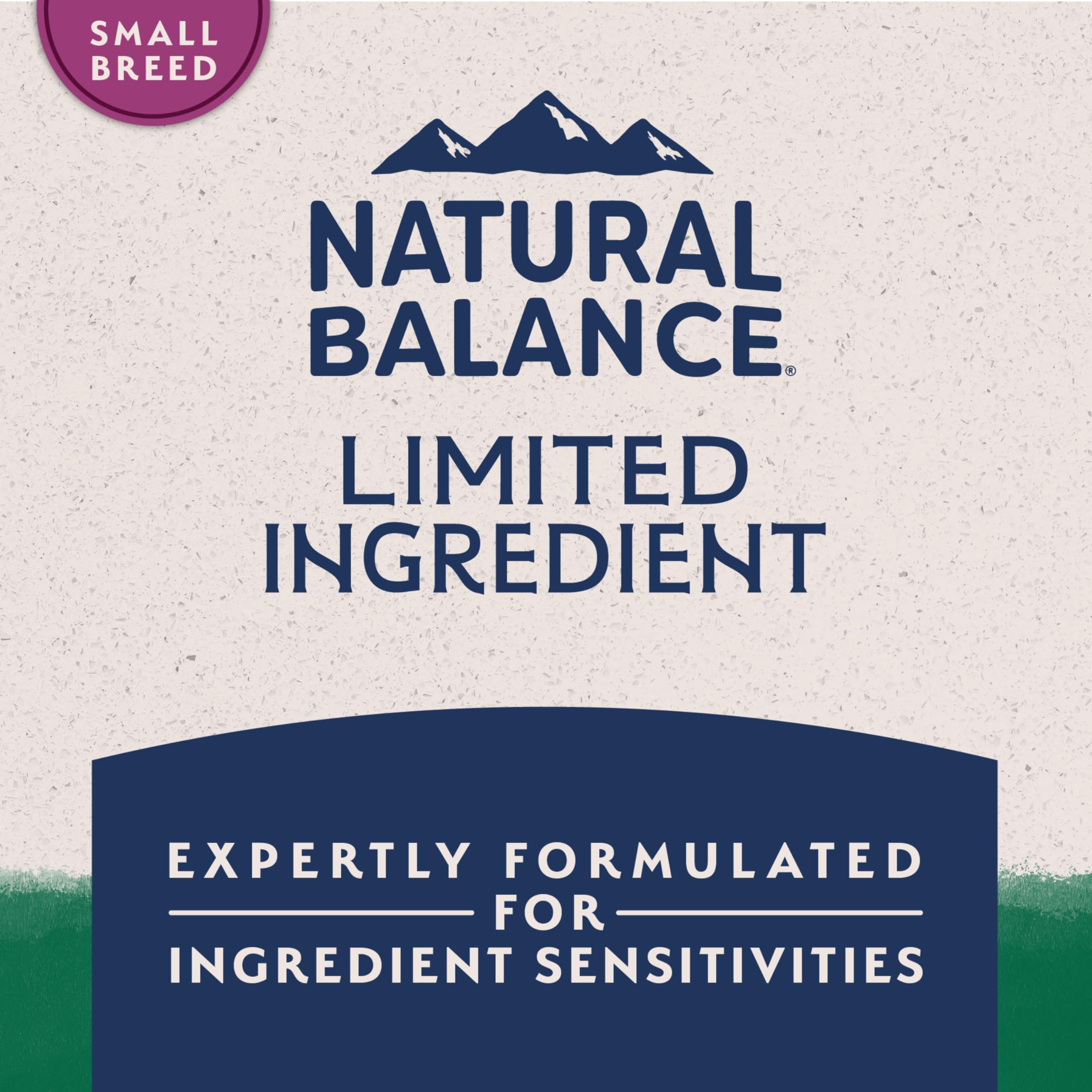 Natural Balance kibble size compared to hand indicating small-breed fit