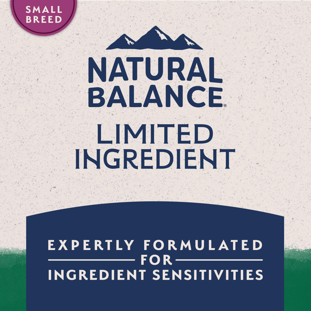Natural Balance kibble size compared to hand indicating small-breed fit