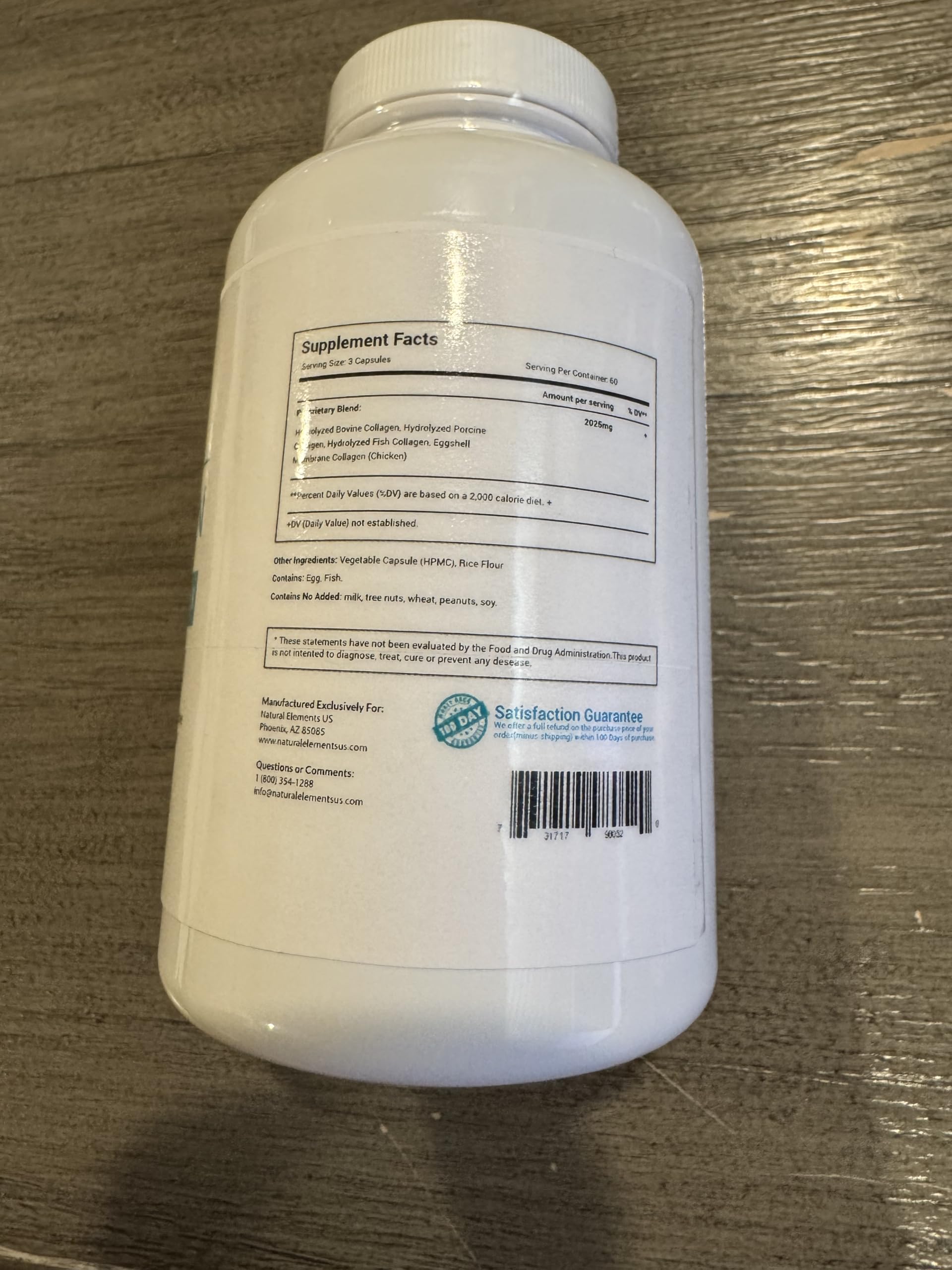 natural elements capsules beside a glass of water suggesting simple daily use