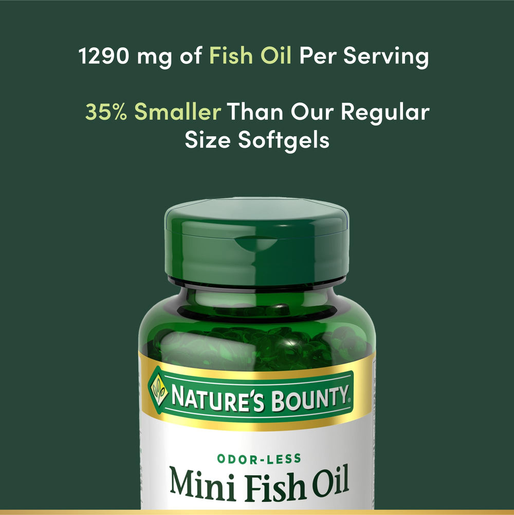 Nature's Bounty softgel next to a coin to show mini fish oil size and swallowability benefit