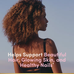 Nature's Bounty open bottle with visible strawberry gummies for easy daily use